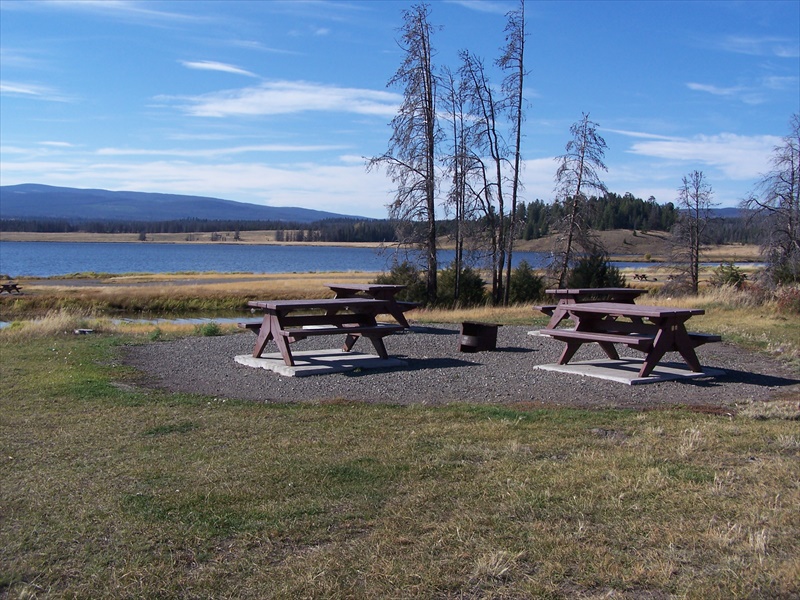 Quad tables near small bay