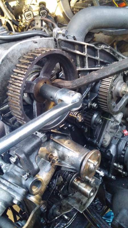 Flat pry braced against some webbing with a breaker on the other side. Persuaded the bolt to move.