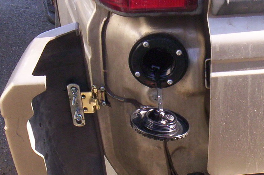 New filler cap on hers, EricN's great idea.<br />Edit: Perko Fill #0590 with 0540DPR mounting ring.