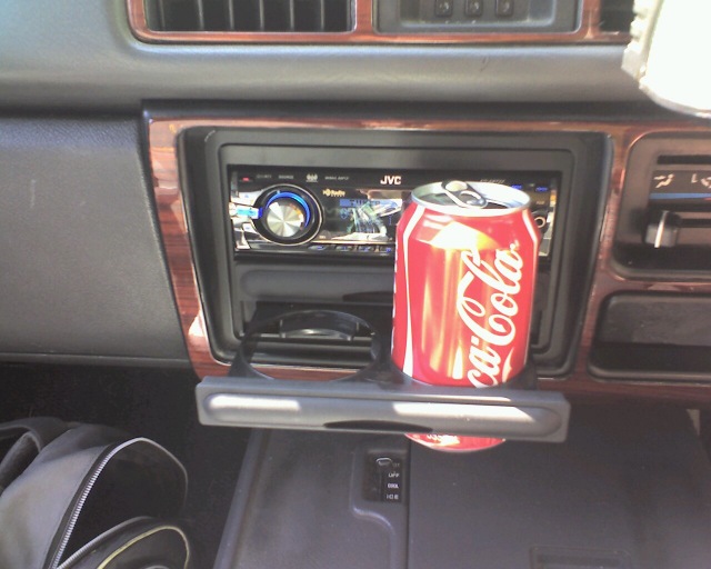 Given the proximity to the radio, this will only hold cans or similarly shaped cups, not the over-sized cups we NA's are generally used to.