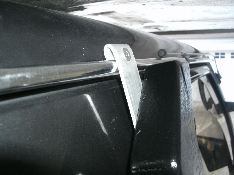 Made a clamp out of extruded aluminum and a stainless bolt, made for a very secure mount, and didn't require more drilling!!