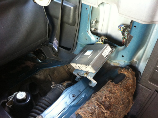 Location of the ECU, behind the right-hand seat, above the hatch with the power steering fluid. The Glow Plug Relay is inside the hatch.