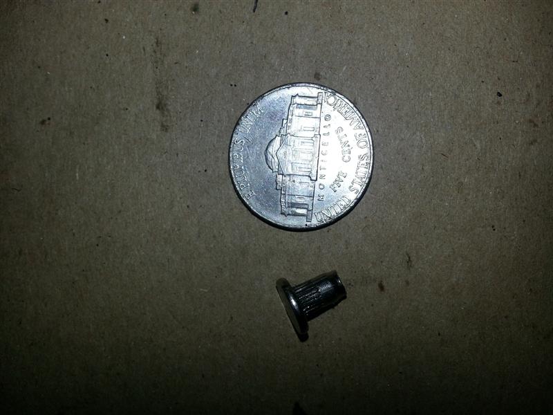 Small SS piece found under valve cover in corner of head.