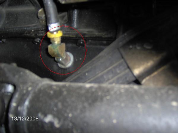 This where the oil returns back to the oil pan. The kit came with a little punch to make a hole in the side of the pan and a self tapping fitting.  Very slick set up.  I kept it high to keep it protected not that I do any off roading.  My van is a urban cruiser that doesn't often see dust let alone mud.