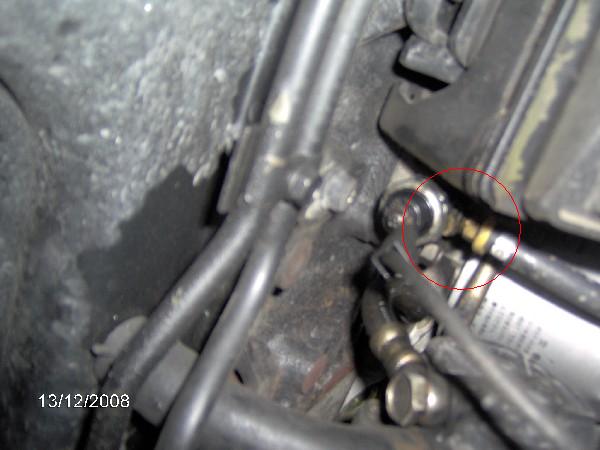 This pic shows where the supply line is tee'd in above the oil pressure sending unit.  The fancy little tee, along with all the fittings &amp; hose I needed came with the kit.  If you're unsure of where this is located it is right below your oil filter.  You can see my silver filter in the picture.