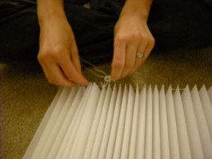 Sewing on plastic sliders.