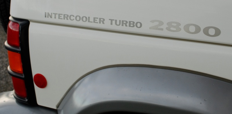 Right there on the fender! 2800cm3, intercooler, turbo. Booyah!